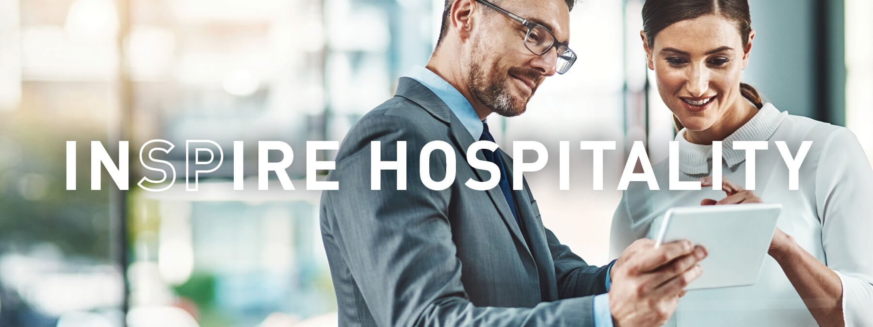hospitality INSPIRE hospitality - woman and man speaking in office
